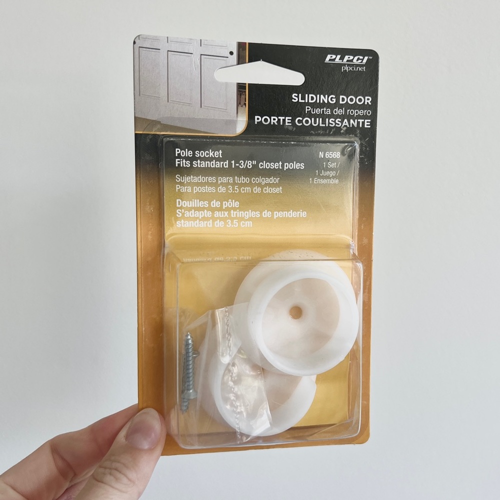 White plastic closet pole sockets